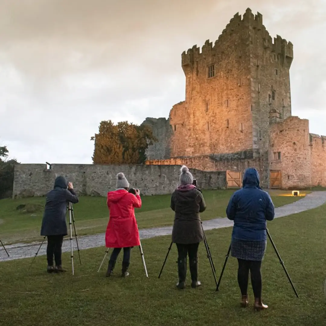 Winter Wonderland Photo Walk Tour 4 people taking photos of Ross Castle in Killarney