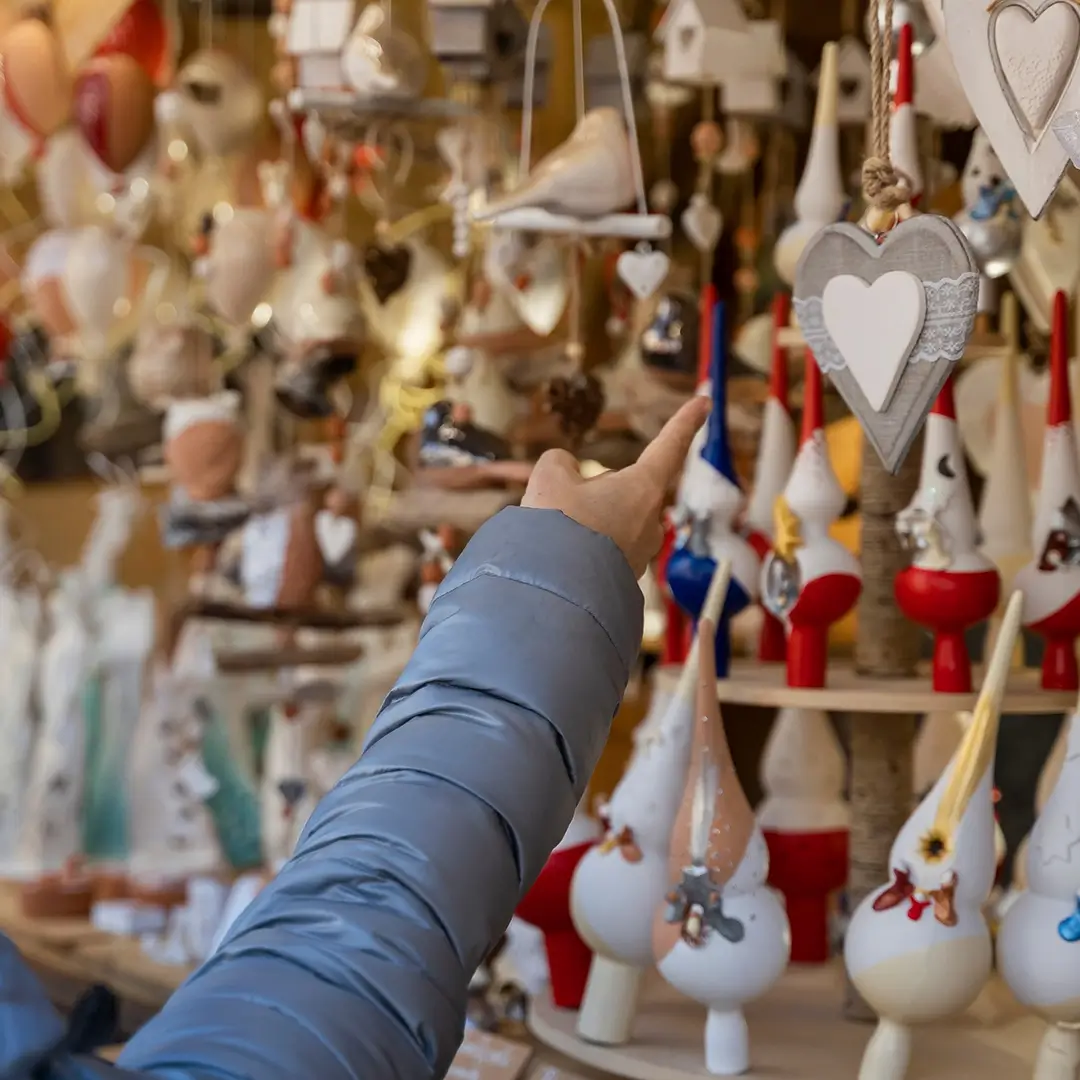 Christmas Markets person pointing at decorations